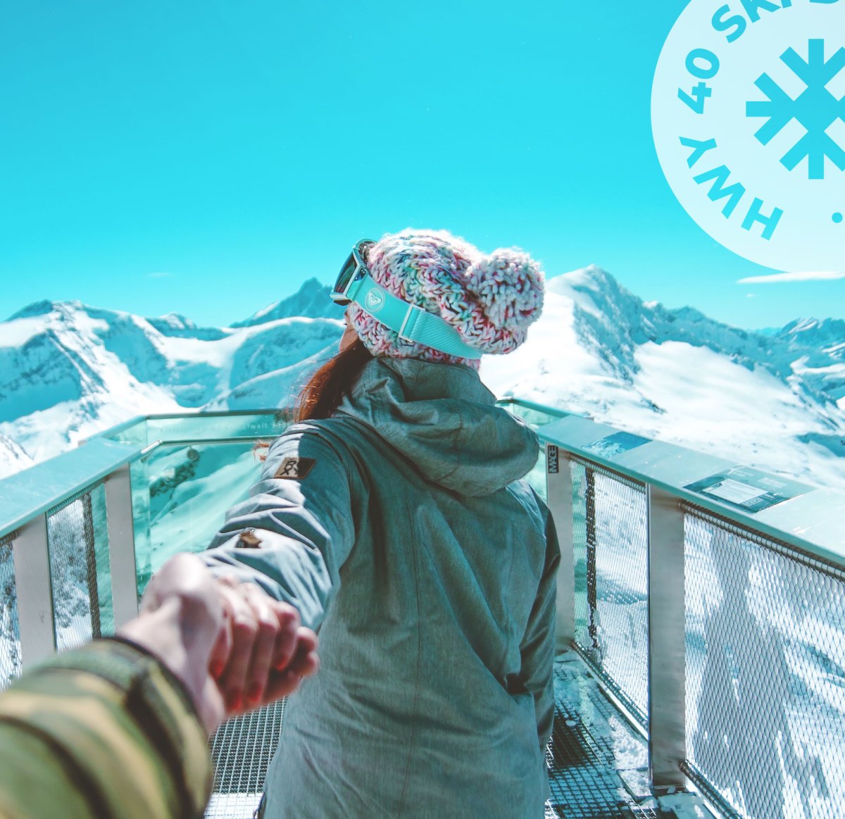 HWY40_Web_About_Middle-Image a person standing next to a fence