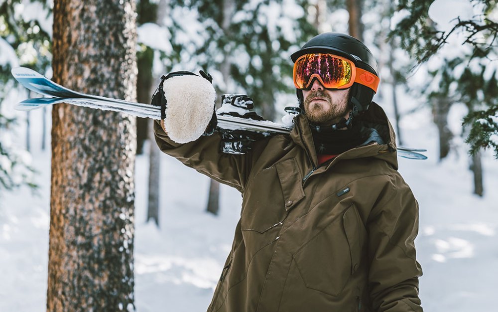 a person that is standing in the snow