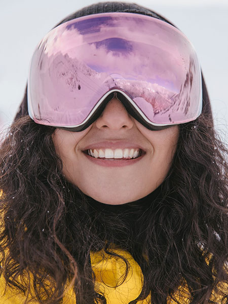 a woman wearing a hat and sunglasses